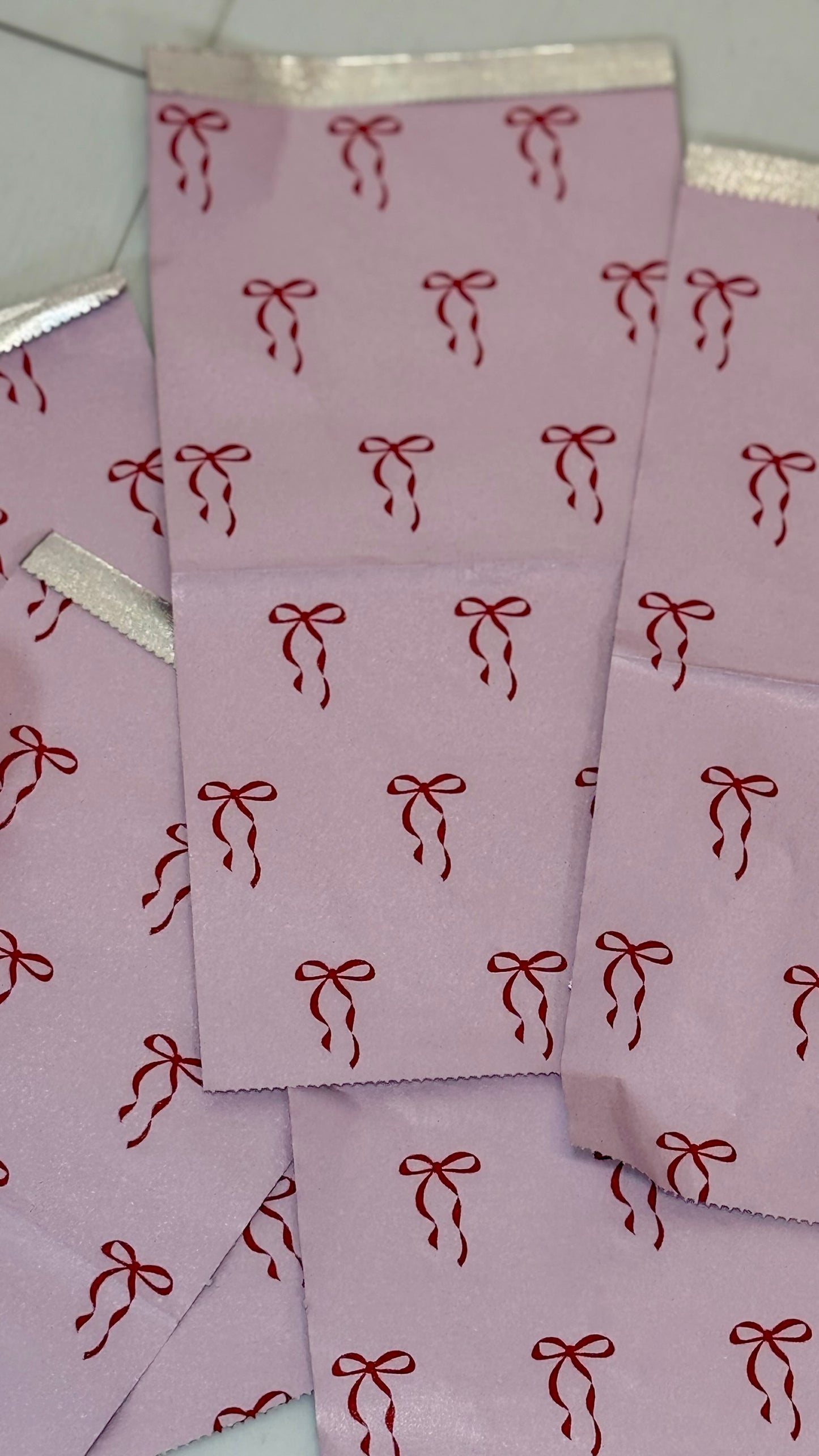 Close-up of pink Self Love Hair Club foils with red bow print design