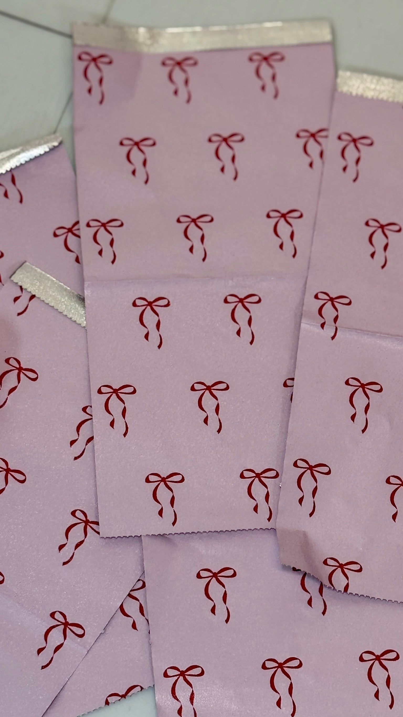 Close-up of pink Self Love Hair Club foils with red bow print design