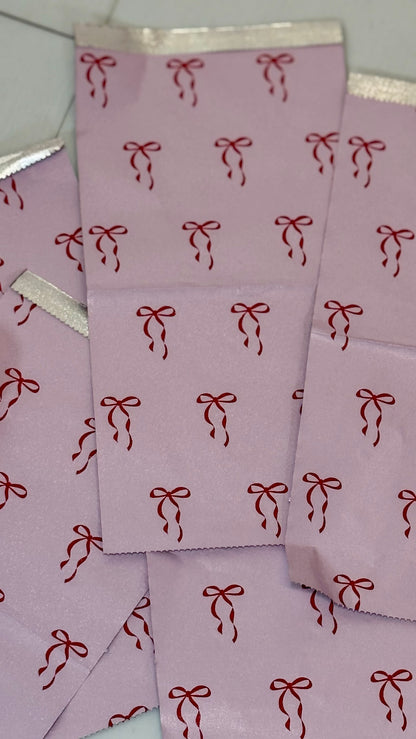 Close-up of pink Self Love Hair Club foils with red bow print design