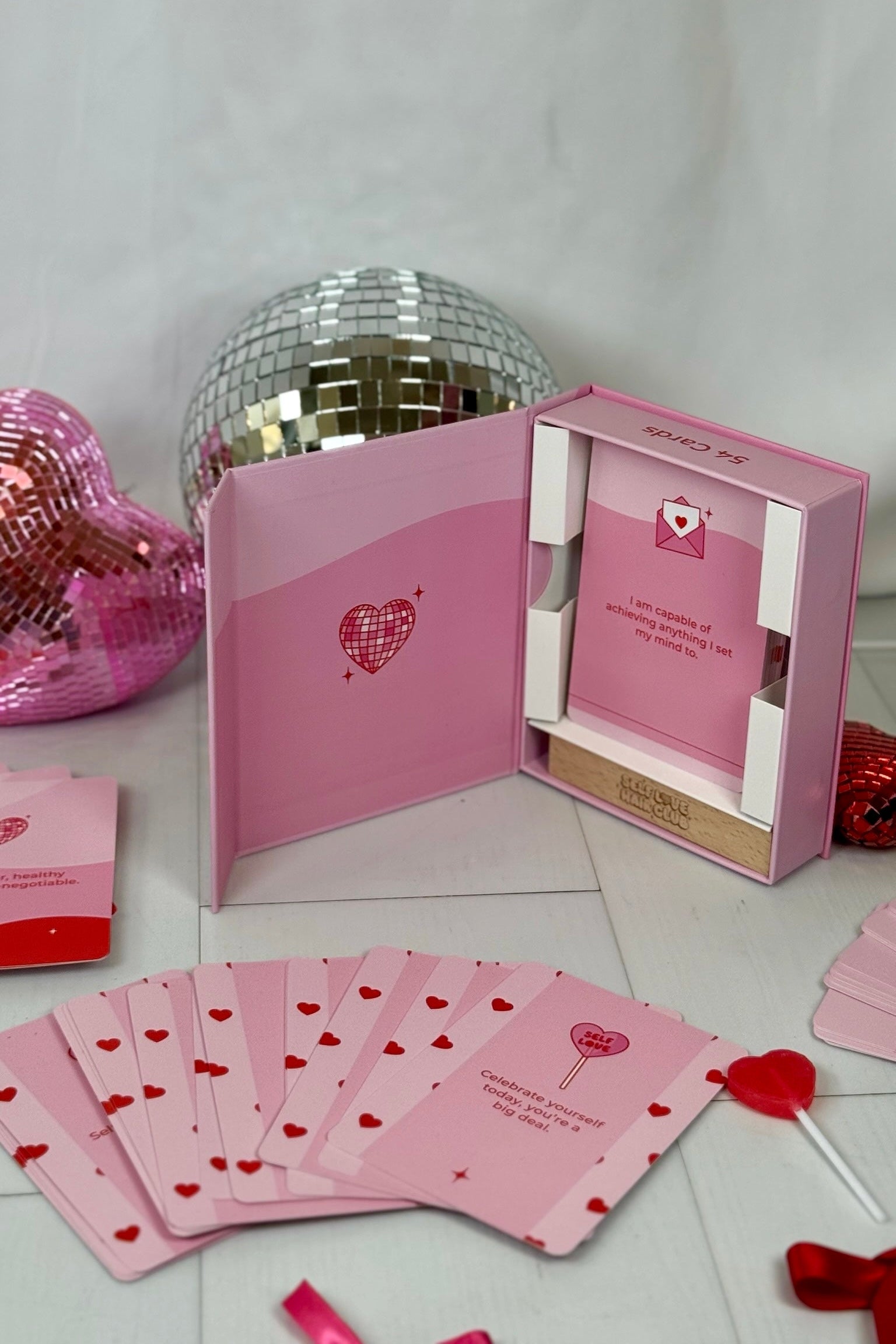 Open Self Love Hair Club affirmation deck box with cards and wooden stand.